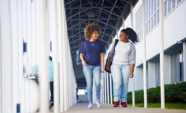 Mercy Bronx campus two students walking down corridor