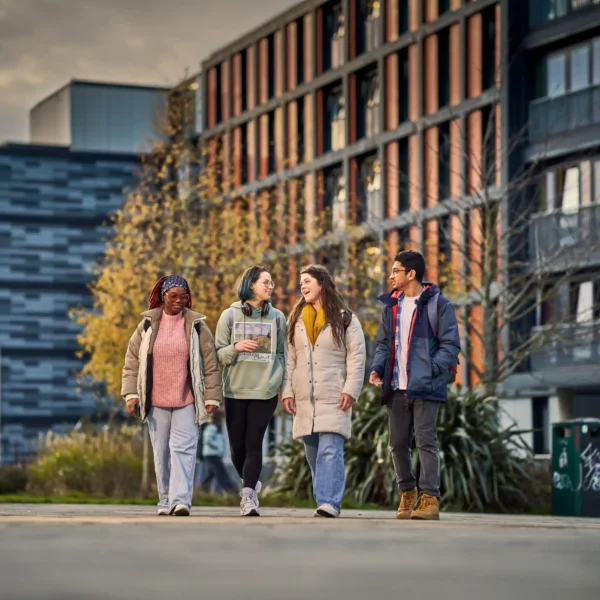 ENU students enjoying campus life outside modern university accommodation