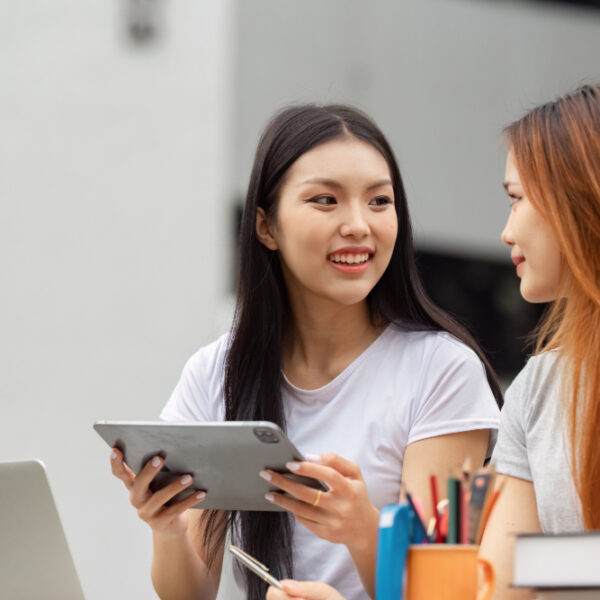 Two students sat working next to each other