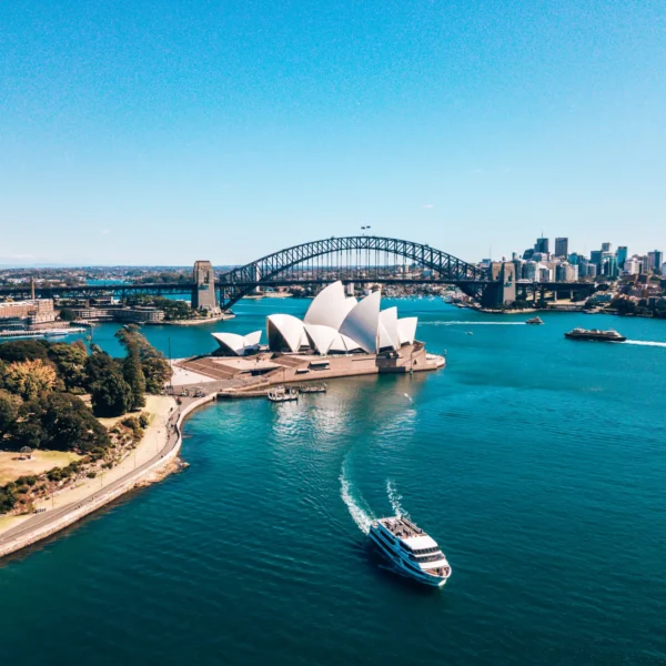 Landscape aerial view of Sydney Opera house near Sydney business center around the harbour.