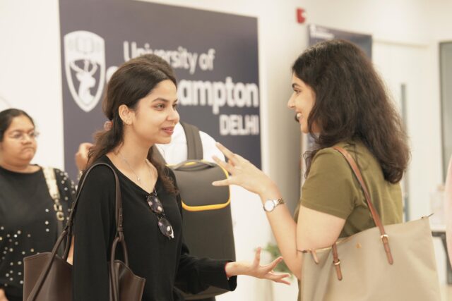 Two students talking to each other