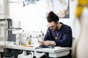 Student using sewing machine in Fashion Atelier