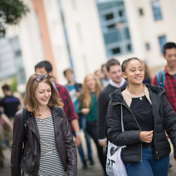 Group of University of Dundee students walking together on campus
